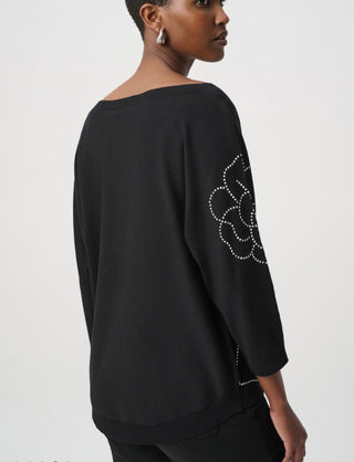 Joseph Ribkoff black pullover back view with flower appliqué on sleeve