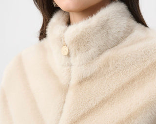 Close-up of chevron faux fur jacket collar and gold zipper charm