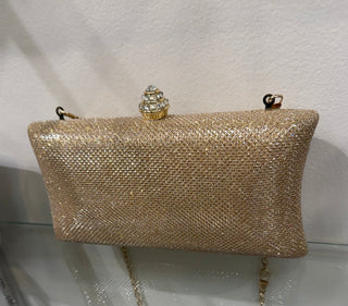 Gold evening clutch with chain strap at Pooja Boutique